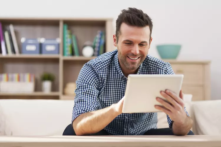 young man looking at device