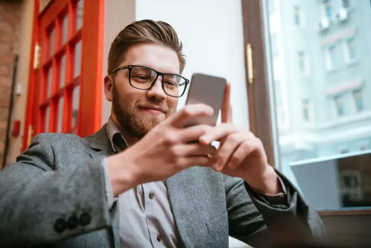 Young professional checking loan details on a smartphone