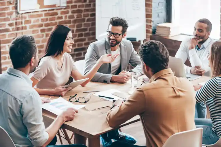 SlickCashLoan team meeting around a table