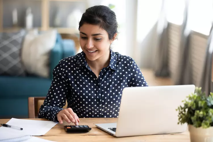 a woman using a calculator