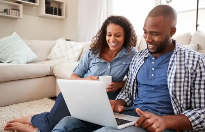 Couple checking credit file online