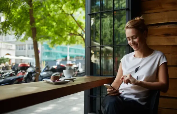 Woman checking credit score on phone