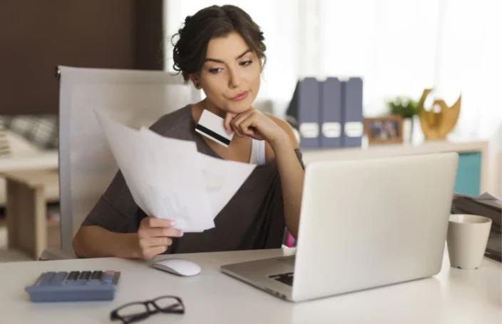 Woman comparing rates on laptop