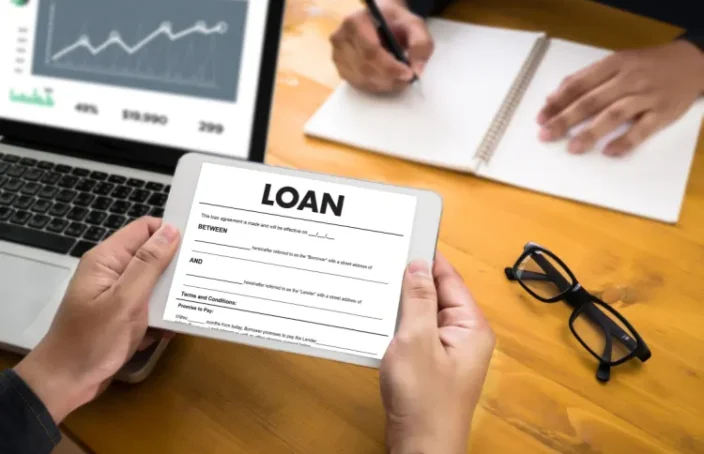 Borrower reviewing loan agreement on a tablet
